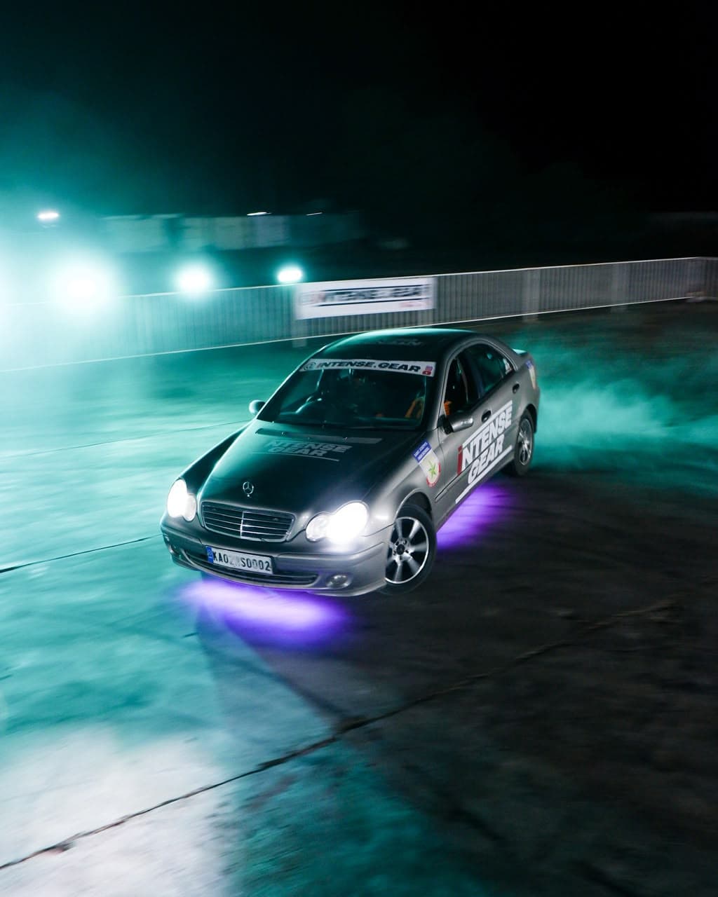 Intense Gear drift car lit in teal smoke